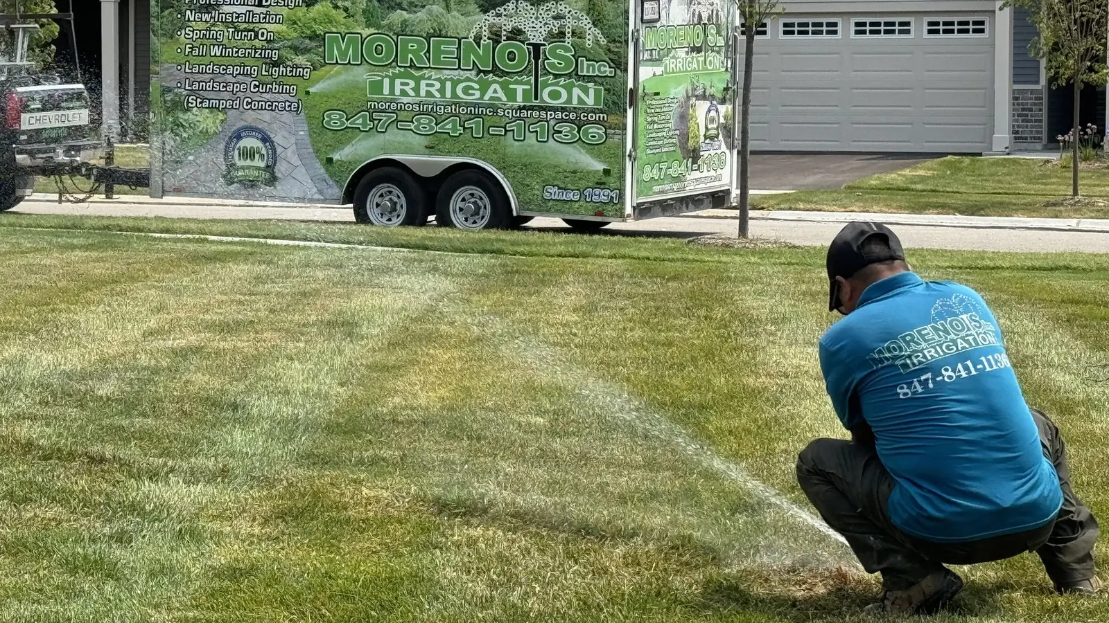 Moreno's Irrigation technician configuring sprinkler coverage